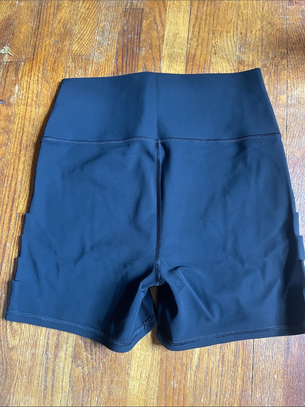 ALO Yoga Black High-Rise Bike Shorts with Side Strap Details - Picture 2 of 4